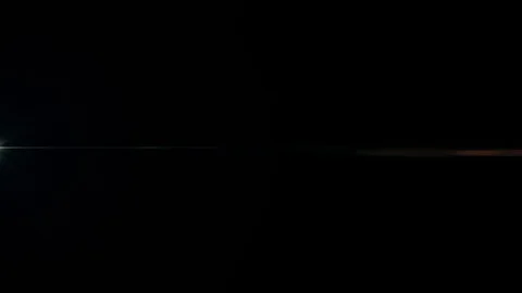 Lens flare effect on black background. A... | Stock Video | Pond5