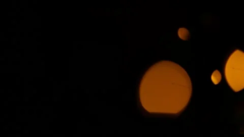 Lens flare effect on black background yellow Stock Footage 145440719