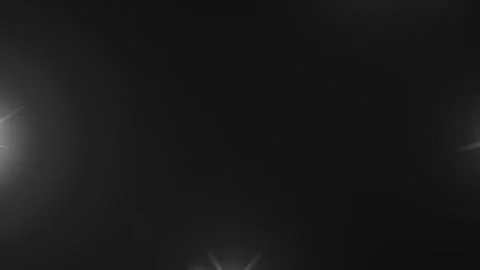 Lens flare effects on black background | Stock Video | Pond5