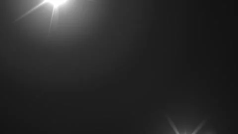 Lens flare effects on black background | Stock Video | Pond5