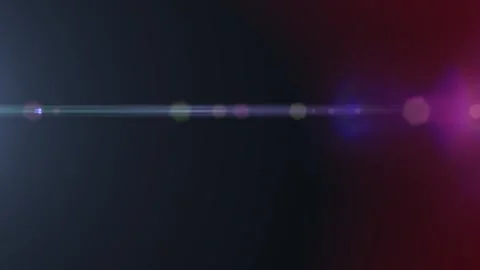 Lens flare glows softly across dark space Video stock 337955549