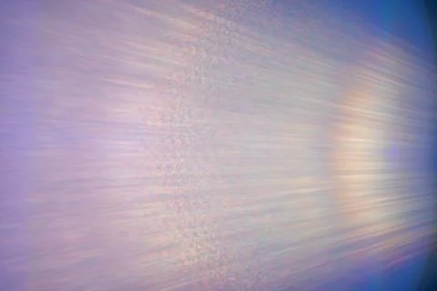 Lens flare light leak create a vibrant and colorful backdrop with blurred tex Stock Photos