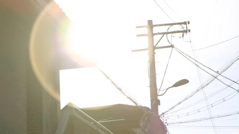 Lens Flare Over Utility Pole, Urban South Korea, Bright Morning Sun (FHD) Stock Footage 332693593
