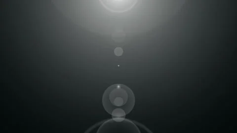 Lens Flare Transition with Subtle Light Streaks and Bokeh Effect During Dar.. Stock Footage 342515206