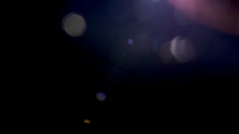 Lens flares effects on black background | Stock Video | Pond5