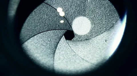 Lens iris close up with passing light Stock Footage 38900617