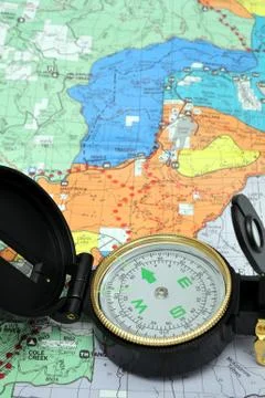 Lensatic compass and map Stock-Fotos
