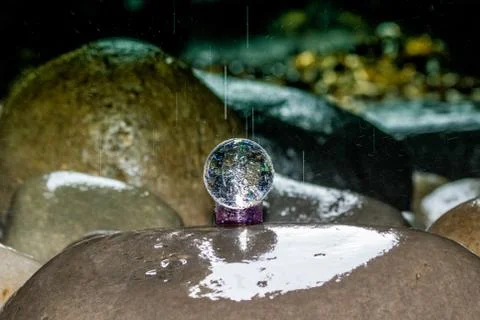 Lensball in a waterfall Stock Photos