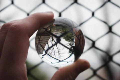 Lense ball in a cage 库存照片