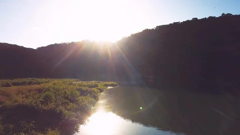 Lense flare in the river Video stock 100756179