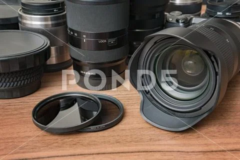 Lenses of DSLR digital camera, filters and other equipment. Stock Photos