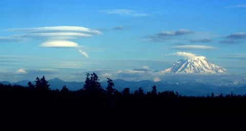 Lenticular cloud forming downwind of mt. rainier Stock Photos