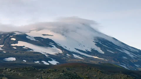 Lenticular cloud forming over Snaefellsjokull volcano peak in Iceland Stock Footage 330284100