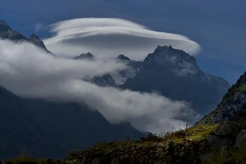 Lenticular cloud over the Caucasus mountains. Stock Photos