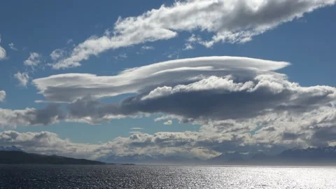 Lenticular clouds over Beagle Channel Patagonia mountains, 4K Stock Footage 332400201
