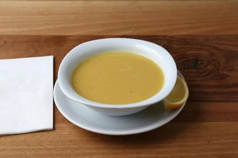 Lentil soup with a lemon slice Stock Photos