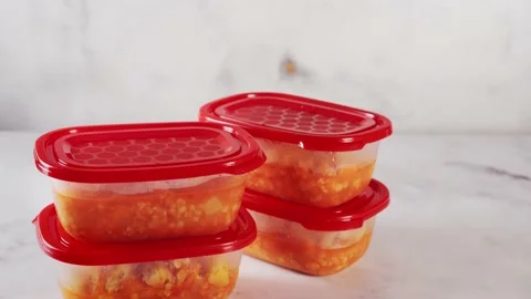Lentil soup placed into four plastic containers for storage Stock Footage 138378838