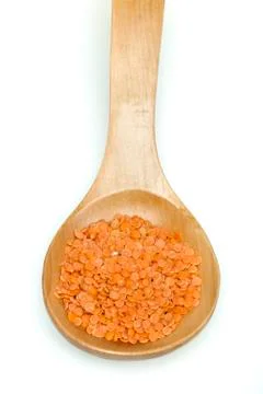 Lentil split in wooden spoon Stock Photos
