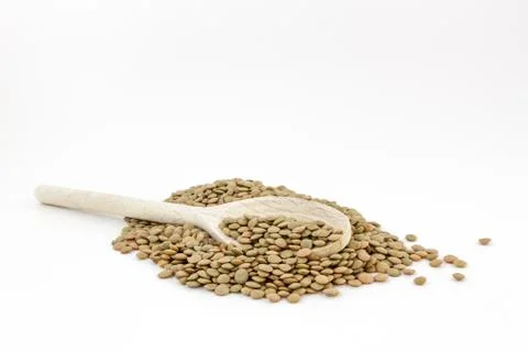 Lentil in spoon Stock Photos