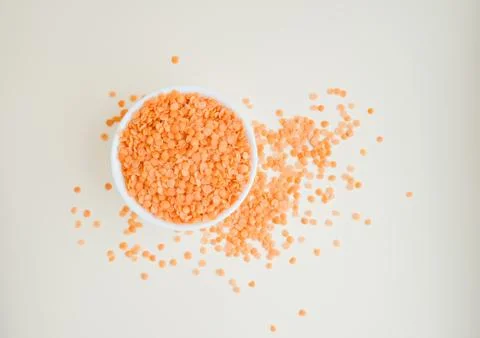 Lentils in a cup on a light background Stock Photos