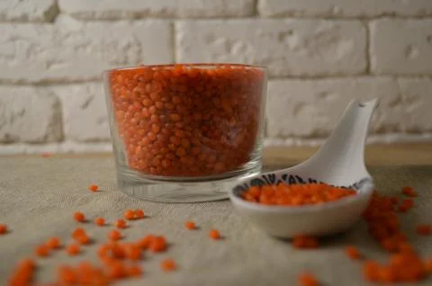Lentils in the dishes on the table. Stock Photos