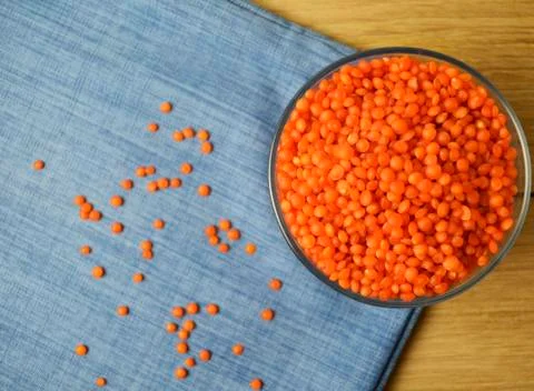 Lentils in the dishes on the table. Stock Photos