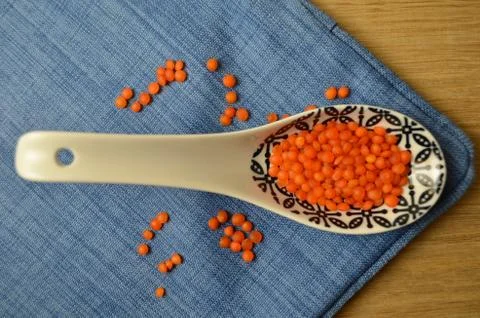 Lentils in the dishes on the table. Stock Photos