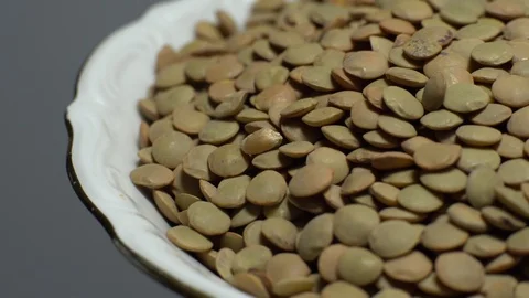 Lentils. Heap of raw uncooked brown lentils 動画素材 102410992