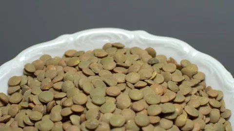Lentils. Heap of raw uncooked brown lentils Stock Footage 102411098