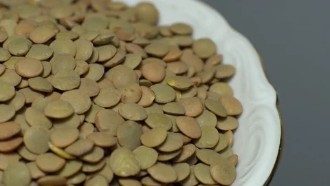 Lentils. Heap of raw uncooked brown lentils Stock Footage 102411285