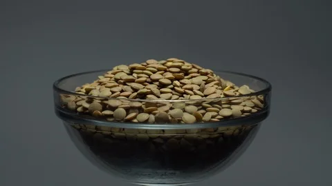 Lentils. Heap of raw uncooked brown lentils Video stock 102412215