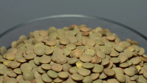Lentils. Heap of raw uncooked brown lentils Video stock 102412525