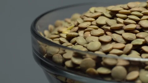 Lentils. Heap of raw uncooked brown lentils Video stock 102412527