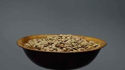 Lentils. Heap of raw uncooked brown lentils Video stock 102412699