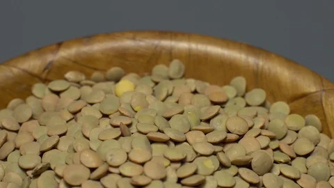 Lentils. Heap of raw uncooked brown lentils Stock Footage 102412862