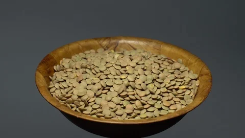Lentils. Heap of raw uncooked brown lentils Video stock 102413064
