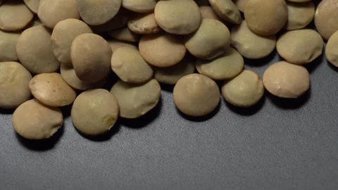 Lentils. Heap of raw uncooked brown lentils Stock Footage 102457605
