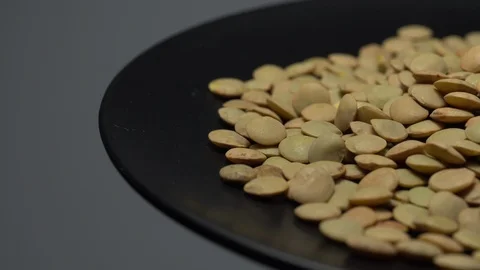 Lentils. Heap of raw uncooked brown lentils Video stock 102458909