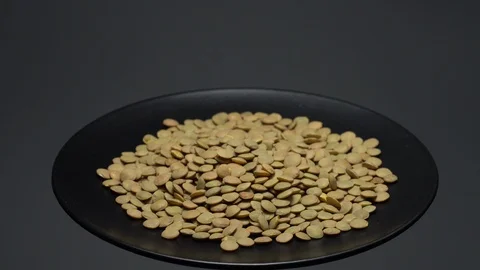 Lentils. Heap of raw uncooked brown lentils Stock Footage 102459261