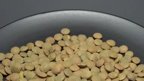Lentils. Heap of raw uncooked brown lentils Stock Footage 102459443