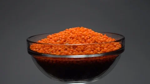 Lentils. Heap of raw uncooked red lentils in bowl. Stock Footage 102459720
