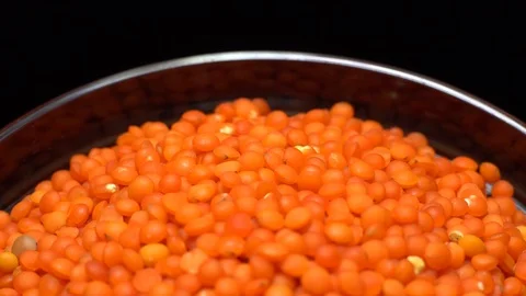 Lentils. Heap of raw uncooked red lentils in bowl in rotation. Stock Footage 102460917