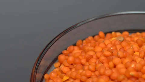 Lentils. Heap of raw uncooked red lentils in bowl. Stock Footage 102461005