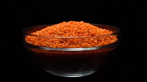 Lentils. Heap of raw uncooked red lentils in bowl in rotation. Stock Footage 102461447