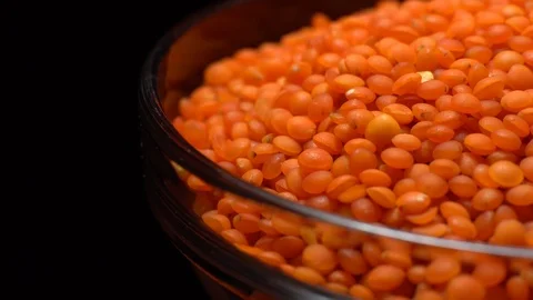 Lentils. Heap of raw uncooked red lentils in bowl in rotation. Stock Footage 102461499