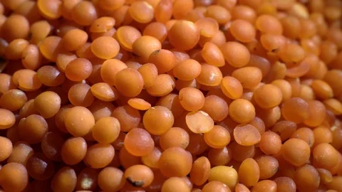 Lentils. Heap of raw uncooked red lentils in bowl in rotation. Stock Footage 102461787