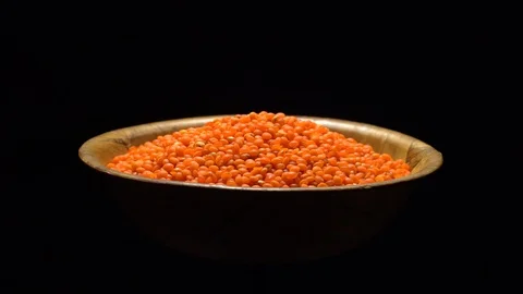 Lentils. Heap of raw uncooked red lentils in bowl in rotation. Stock Footage 102462768