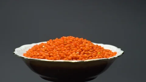 Lentils. Heap of raw uncooked red lentils in bowl. Stock Footage 102478480