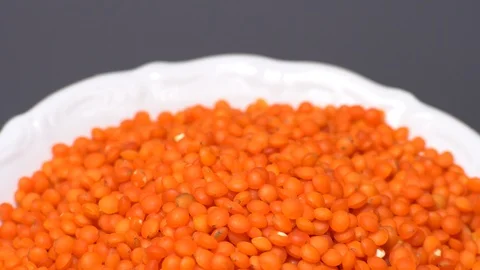 Lentils. Heap of raw uncooked red lentils in bowl. Stock Footage 102478567