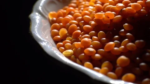 Lentils. Heap of raw uncooked red lentils in bowl in rotation. Stock Footage 102479038